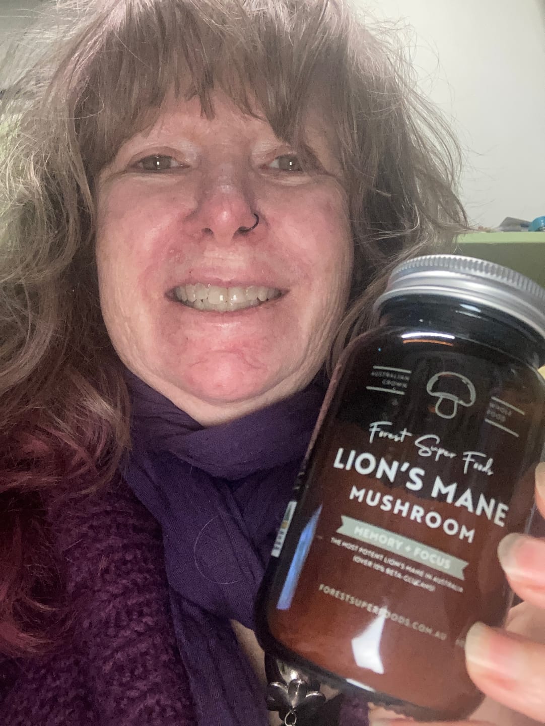 Customer holding a bottle of Forest Super Foods Ashwagandha capsules